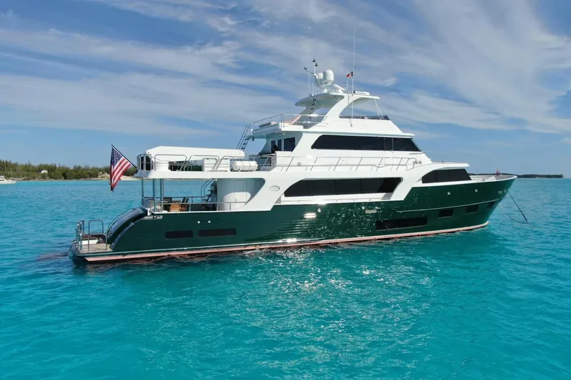 Slide: The Image of 2024 Marlow 90 V yacht on turquoise water under clear sky. - 111