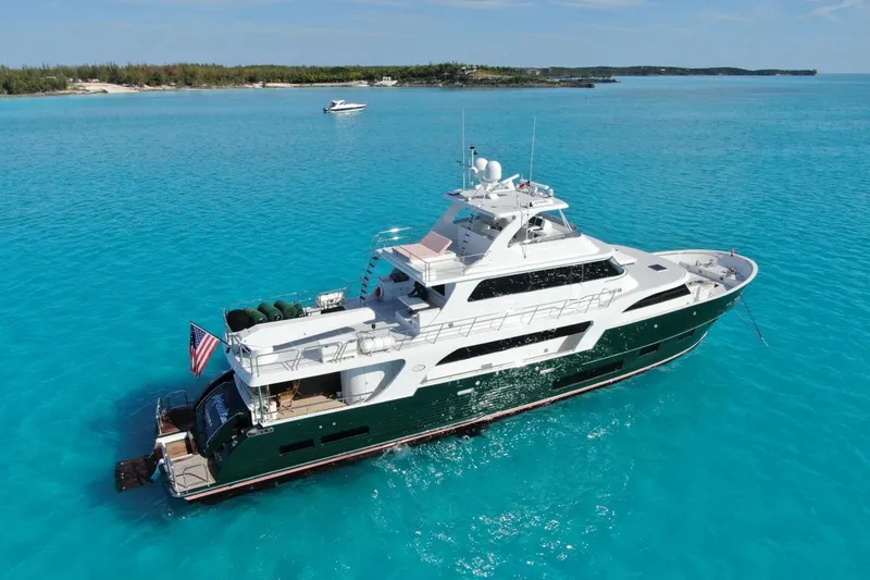 Slide: The Image of Luxurious 2024 Marlow 90 V yacht cruising in clear turquoise waters. - 114