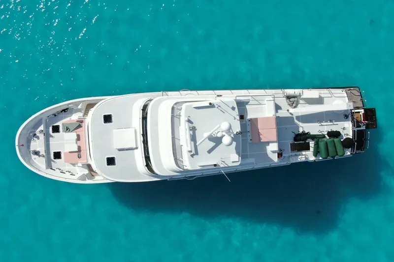Slide: The Image of Aerial view of 2024 Marlow 90 V yacht on turquoise water. - 115