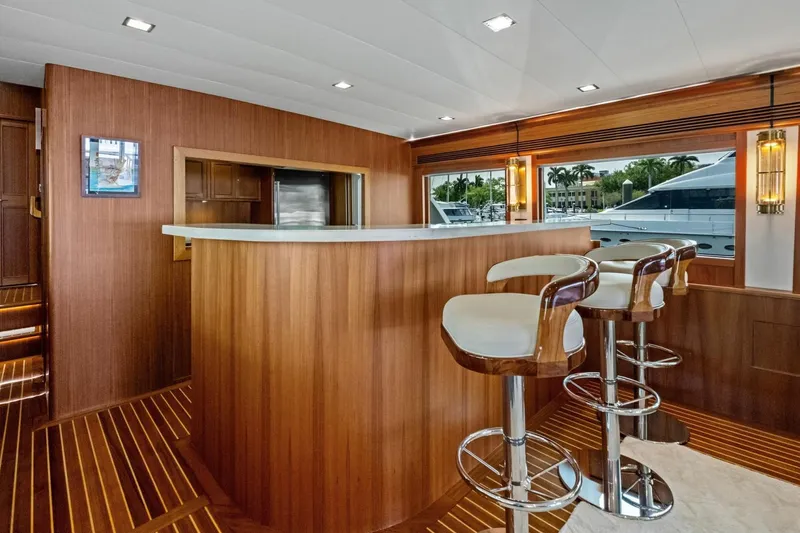 Slide: The Image of Luxurious interior of 2024 Marlow 90 V yacht with elegant bar and stools. - 13