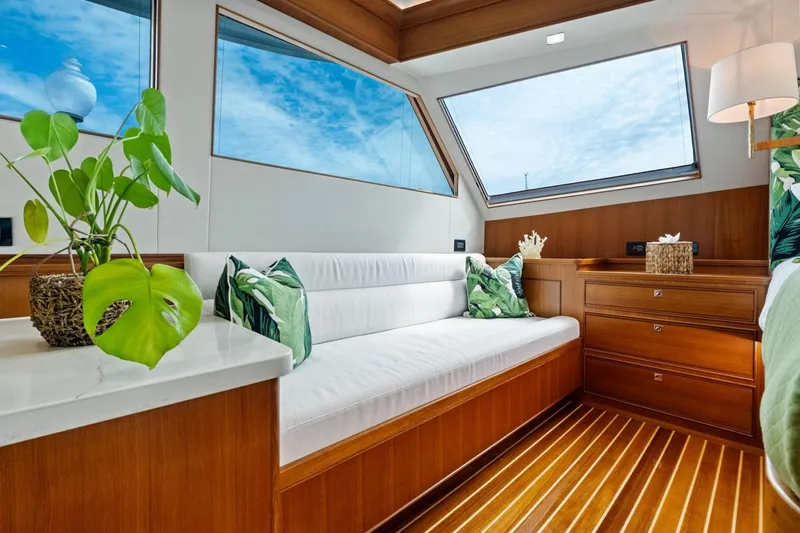 Slide: The Image of Luxurious interior of 2024 Marlow 90 V yacht with elegant wood finish and modern decor. - 30
