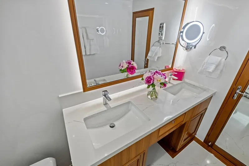 Slide: The Image of Luxurious bathroom in 2024 Marlow 90 V yacht with dual sinks and elegant decor. - 33