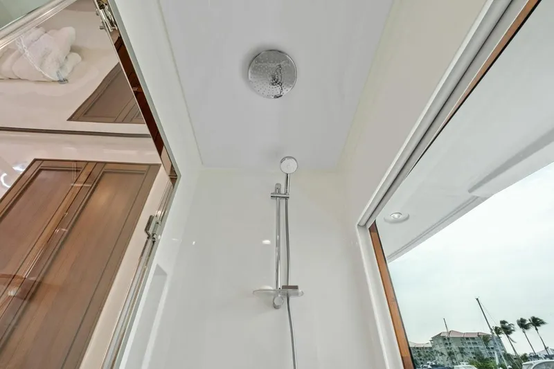 Slide: The Image of Luxury shower area in 2024 Marlow 90 V yacht with modern fixtures. - 34