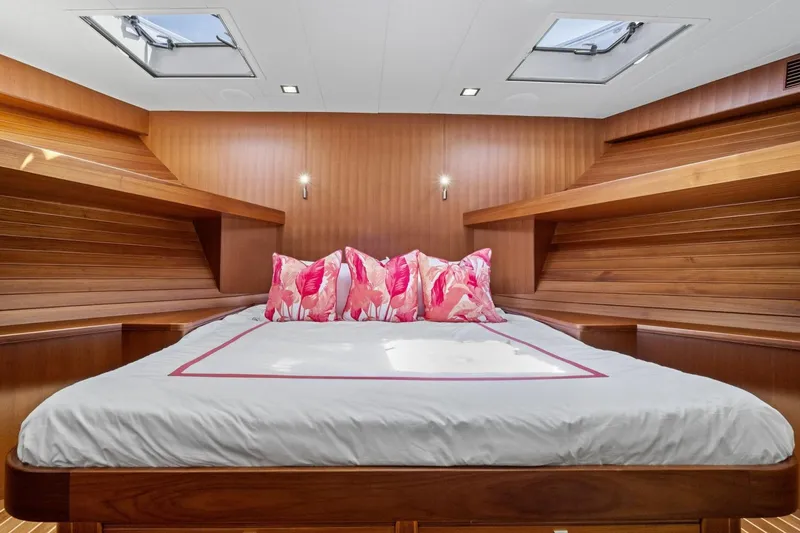 Slide: The Image of Luxurious cabin interior of 2024 Marlow 90 V yacht with skylights and vibrant pillows. - 37