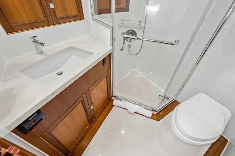 Slide: The Image of Luxurious bathroom in 2024 Marlow 90 V yacht with modern fixtures and elegant design. - 40