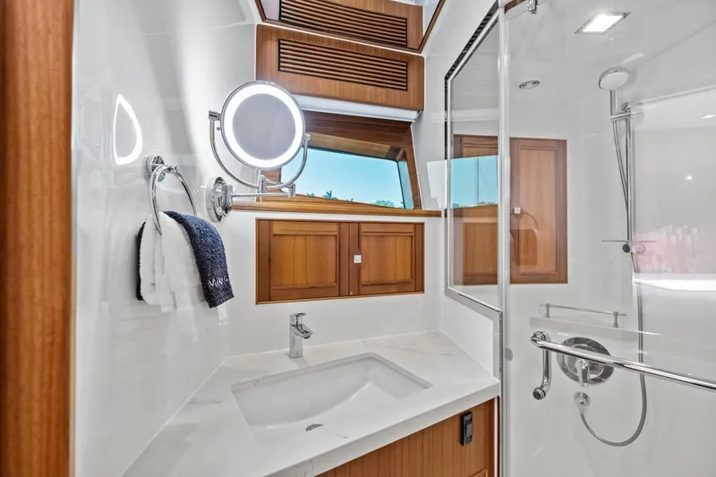 Slide: The Image of Luxurious bathroom in 2024 Marlow 90 V yacht with modern fixtures and wooden accents. - 41