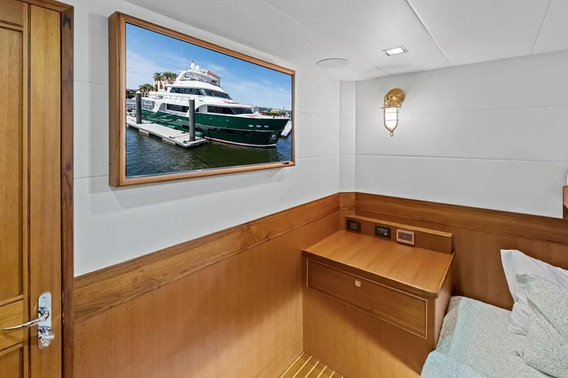 Slide: The Image of Luxurious cabin interior of 2024 Marlow 90 V yacht with framed yacht photo. - 43