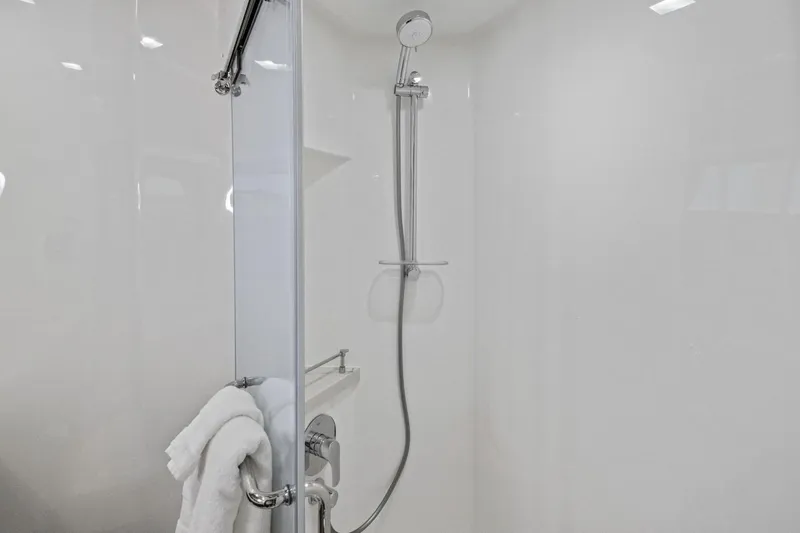 Slide: The Image of Modern shower area in 2024 Marlow 90 V yacht, featuring sleek design and chrome fixtures. - 45