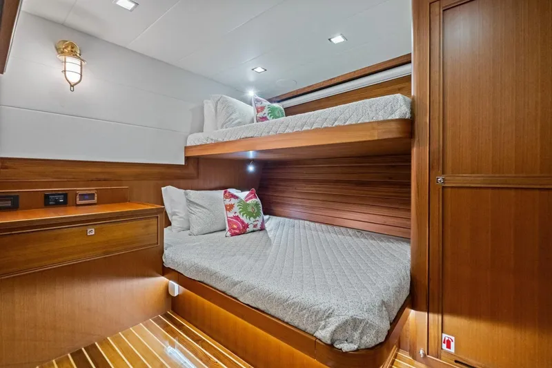Slide: The Image of Luxurious 2024 Marlow 90 V yacht cabin with wooden interior and cozy bunk beds. - 46