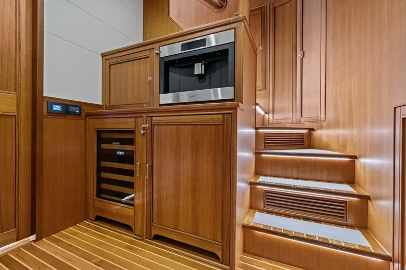Slide: The Image of Luxurious wooden interior of 2024 Marlow 90 V yacht with modern appliances. - 51