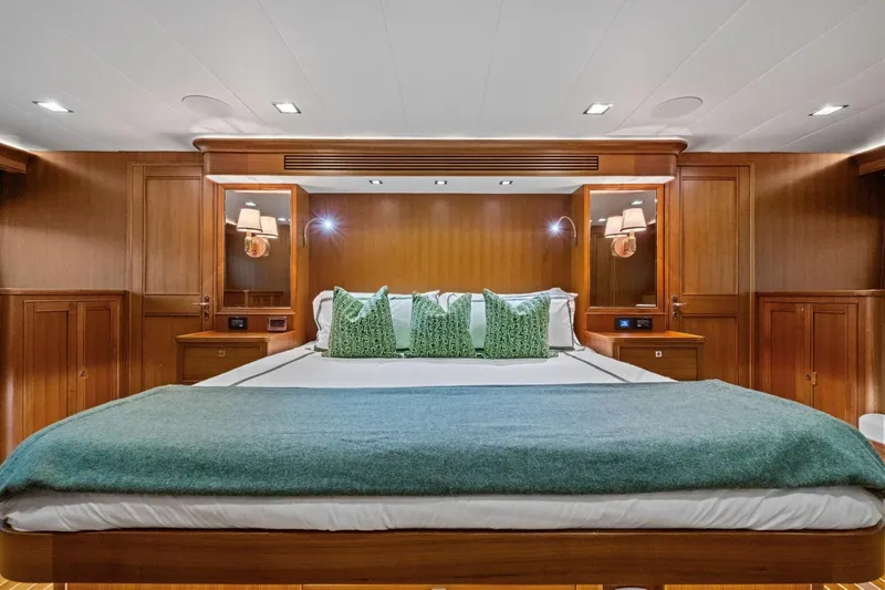 Slide: The Image of Luxurious bedroom interior of 2024 Marlow 90 V yacht with elegant wood paneling. - 53