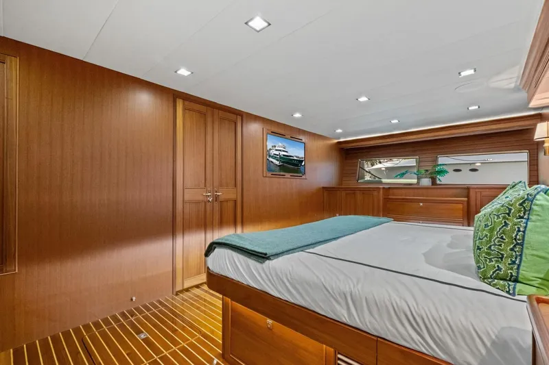 Slide: The Image of Luxurious cabin interior of 2024 Marlow 90 V yacht with elegant wood paneling. - 56