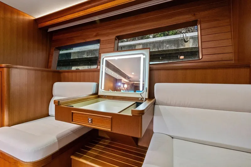 Slide: The Image of Luxurious interior of 2024 Marlow 90 V yacht with elegant wood finish and seating. - 58