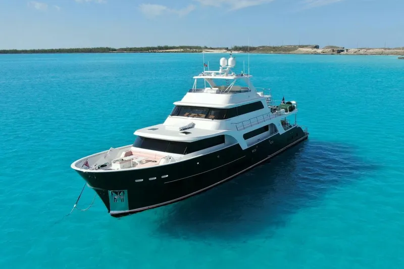 Slide: The Image of Luxury 2024 Marlow 90 V yacht on clear turquoise water. - 6