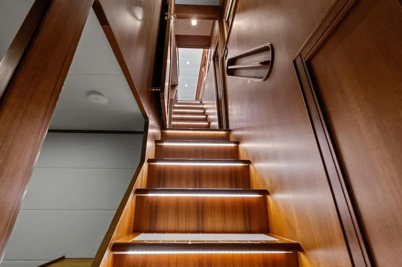 Slide: The Image of Luxurious wooden staircase with LED lighting on Marlow 90 V yacht, 2024 model. - 62