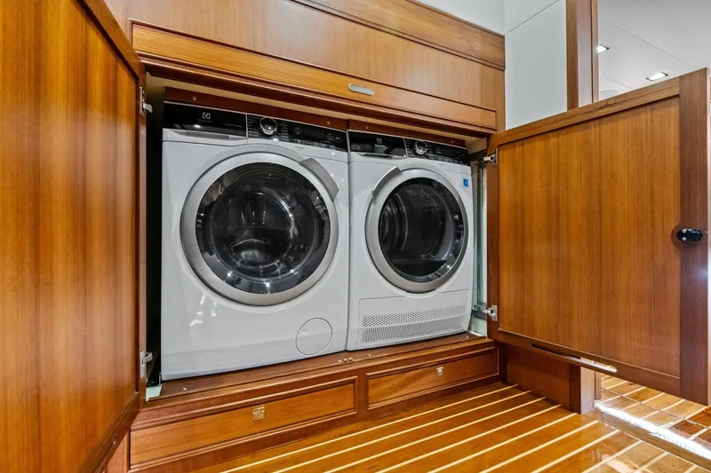 Slide: The Image of Laundry appliances in wooden cabinet aboard 2024 Marlow 90 V yacht. - 63