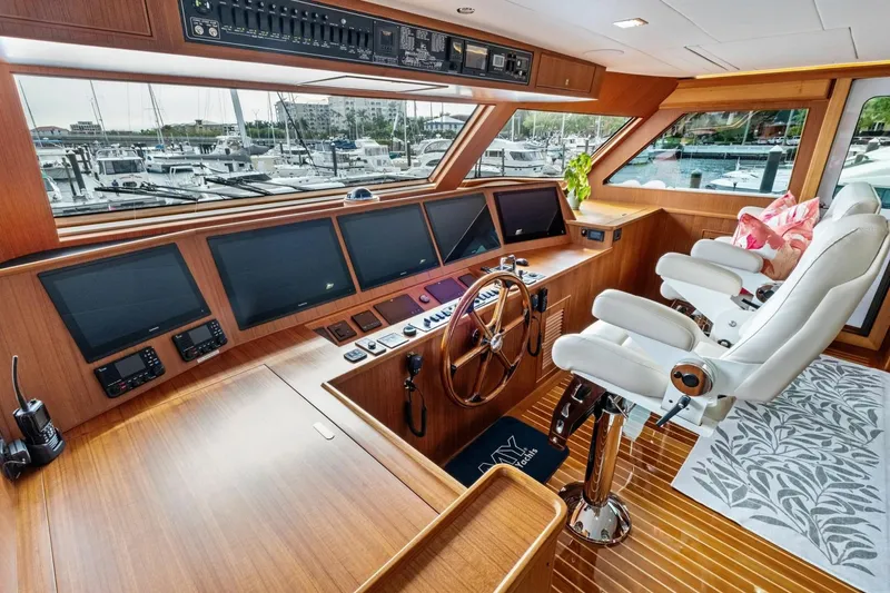 Slide: The Image of Luxurious 2024 Marlow 90 V yacht helm with modern controls and plush seating. - 66