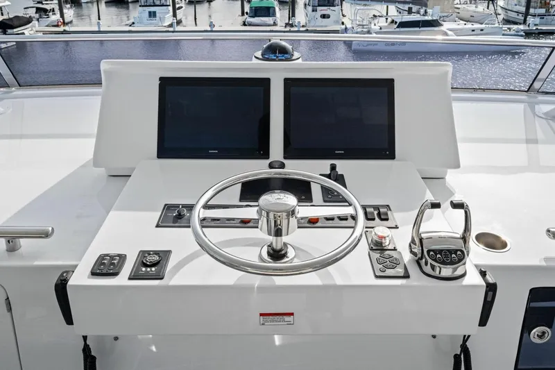 Slide: The Image of Cockpit of 2024 Marlow 90 V yacht with dual screens and steering wheel. - 71