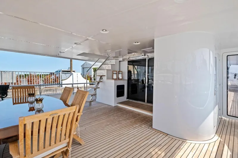 Slide: The Image of Luxurious 2024 Marlow 90 V yacht deck with wooden furniture and modern design. - 73