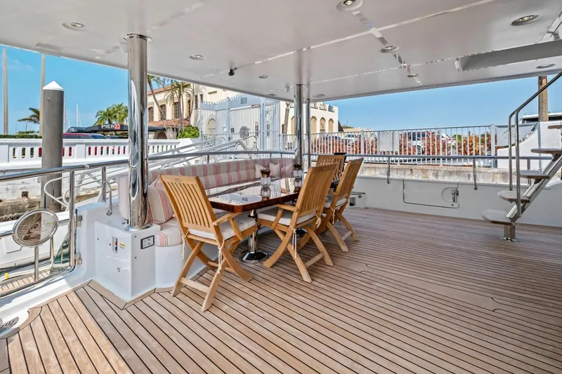 Slide: The Image of Luxury deck of 2024 Marlow 90 V yacht with elegant outdoor dining area. - 76