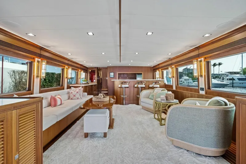 Slide: The Image of Luxurious interior of 2024 Marlow 90 V yacht with elegant seating and large windows. - 8