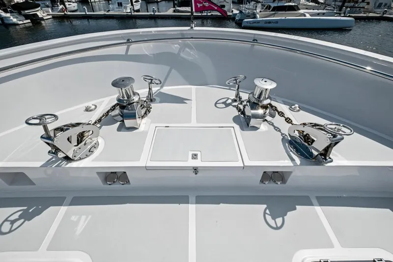 Slide: The Image of Bow deck of 2024 Marlow 90 V yacht with anchor winches and chains. - 87