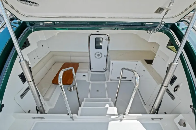 Slide: The Image of Luxurious interior of 2024 Marlow 90 V yacht with seating and kitchenette. - 89