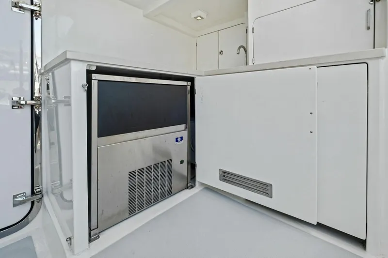 Slide: The Image of 2024 Marlow 90 V yacht interior with built-in stainless steel appliances. - 93