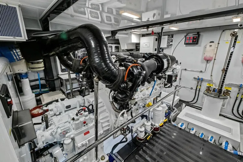 Slide: The Image of Engine room of 2024 Marlow 90 V yacht, showcasing advanced machinery and equipment. - 98