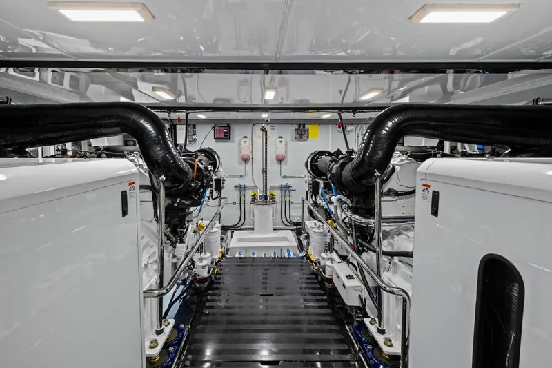 Slide: The Image of Engine room of 2024 Marlow 90 V yacht, showcasing advanced machinery and piping systems. - 99