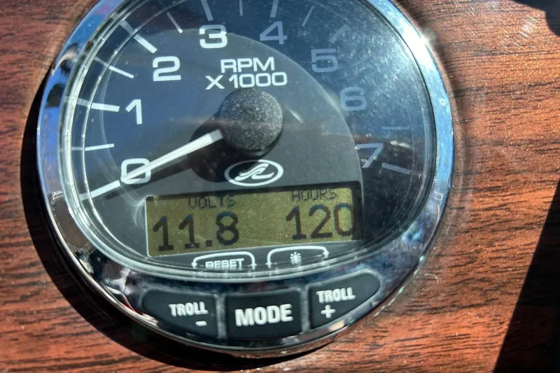 Slide: The Image of Close-up of a 2009 Sea Ray 210 boat tachometer showing 11.8 volts and 120 hours. - 23