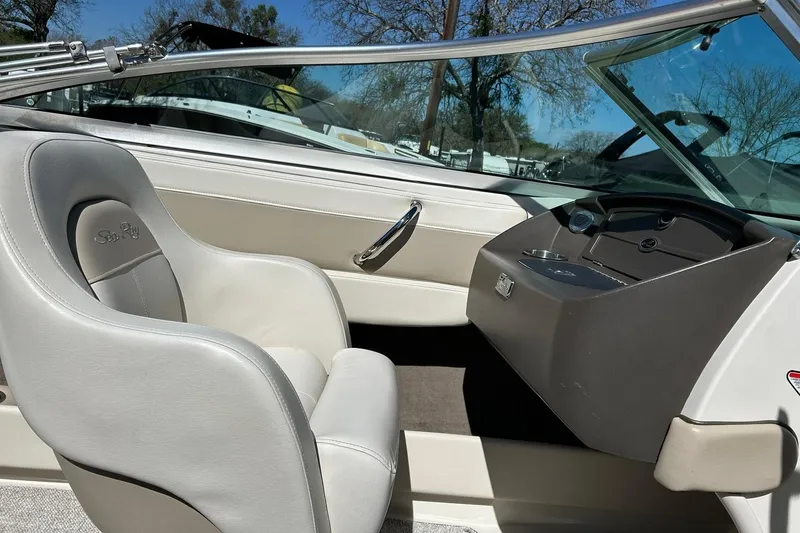 Slide: The Image of Interior of a 2009 Sea Ray 210 boat, featuring a sleek, modern design. - 27