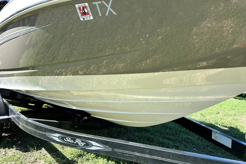 Slide: The Image of 2009 Sea Ray 210 boat on trailer, side view, with registration sticker. - 7