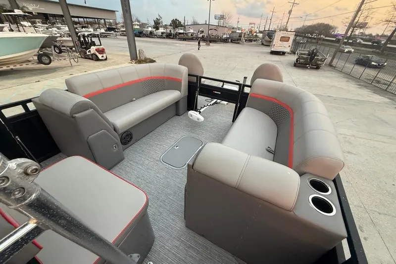 Slide: The Image of 2022 Apex Marine 8524 Pro Fish N Cruise interior with gray seating and cup holders. - 12