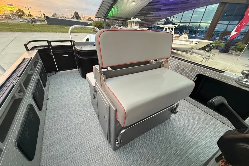 Slide: The Image of 2022 Apex Marine 8524 Pro Fish N Cruise boat interior with seating and storage compartments. - 18