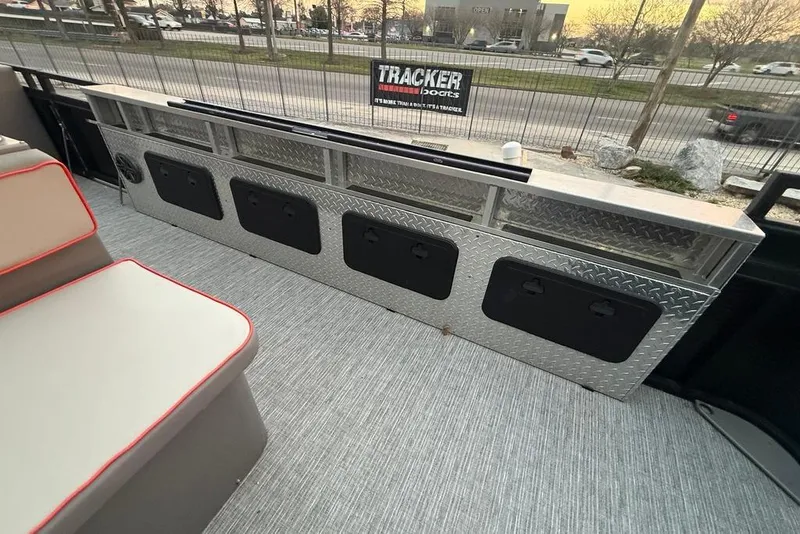 Slide: The Image of 2022 Apex Marine 8524 Pro Fish N Cruise interior with storage compartments and seating. - 22