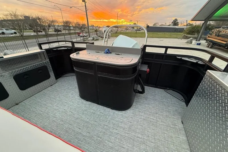Slide: The Image of 2022 Apex Marine 8524 Pro Fish N Cruise boat interior at sunset. - 24