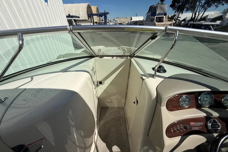 Slide: The Image of 2007 Sea Ray 270 Sundeck interior with dashboard and windshield view. - 11