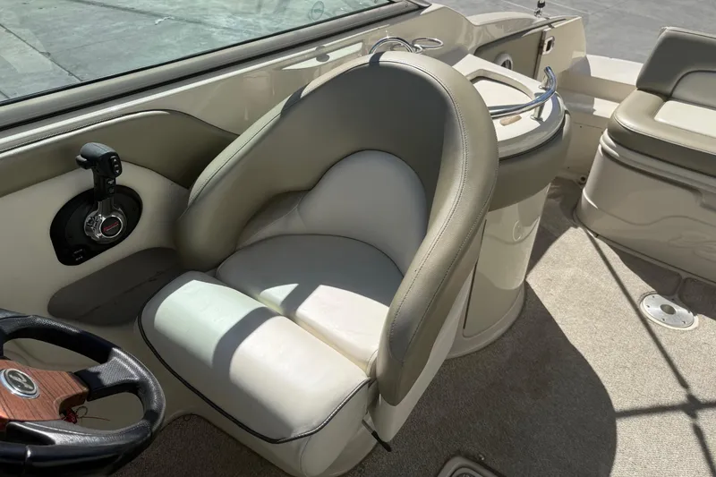 Slide: The Image of 2007 Sea Ray 270 Sundeck interior with steering wheel and seating area. - 17