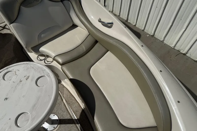 Slide: The Image of 2007 Sea Ray 270 Sundeck interior with seating and table, showcasing luxury design. - 20