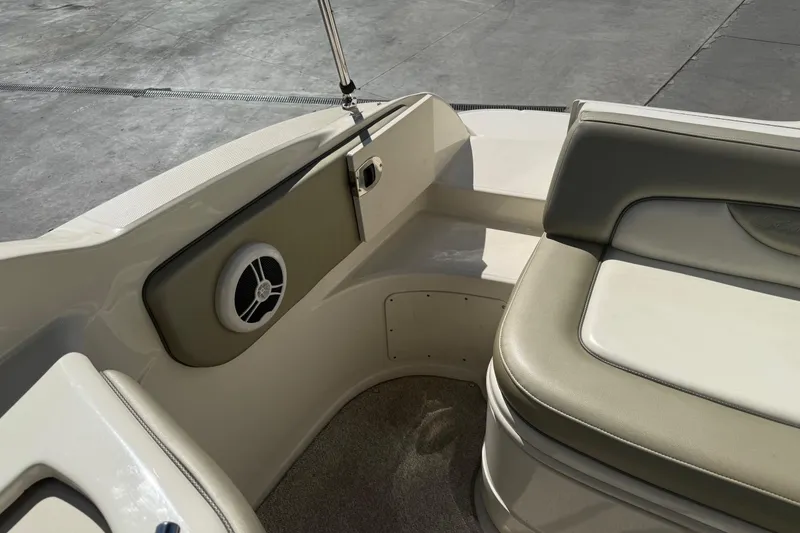 Slide: The Image of 2007 Sea Ray 270 Sundeck interior with cushioned seating and speaker detail. - 8