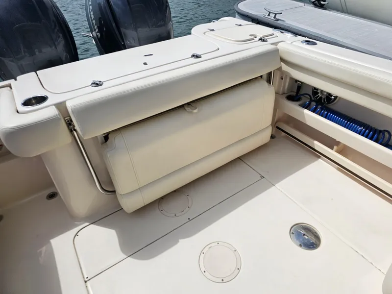 Slide: The Image of Grady-White Freedom 275 2022 boat rear with seating and engines. - 11