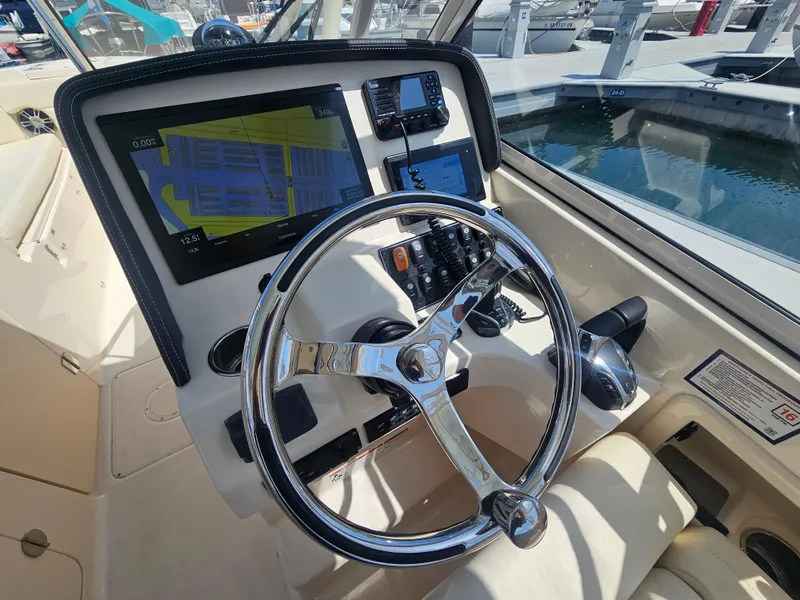 Slide: The Image of Helm console of a 2022 Grady-White Freedom 275 boat. - 13