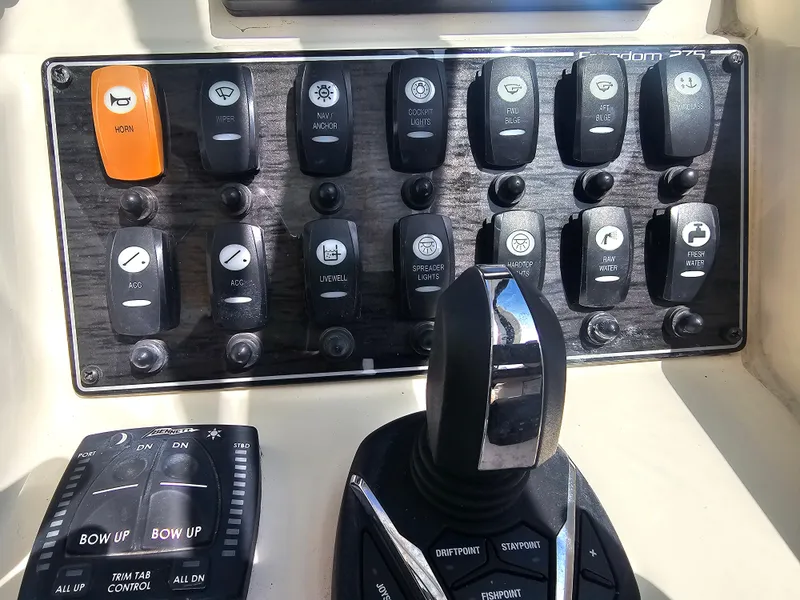 Slide: The Image of Control panel of Grady-White Freedom 275 boat, year 2022. - 16