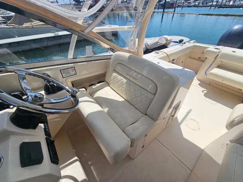 Slide: The Image of Interior of a 2022 Grady-White Freedom 275 boat at the dock. - 18