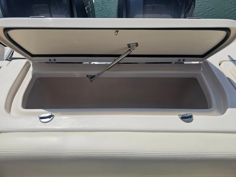 Slide: The Image of Open storage compartment on a 2022 Grady-White Freedom 275 boat. - 26
