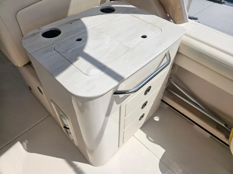 Slide: The Image of Interior of 2022 Grady-White Freedom 275 with storage and cup holders. - 28