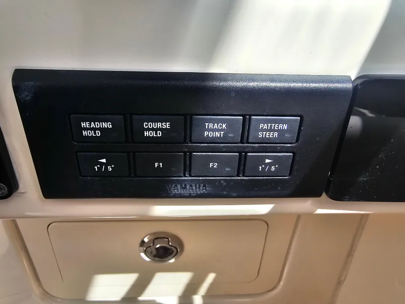 Slide: The Image of Control panel of 2022 Grady-White Freedom 275 with navigation controls. - 29