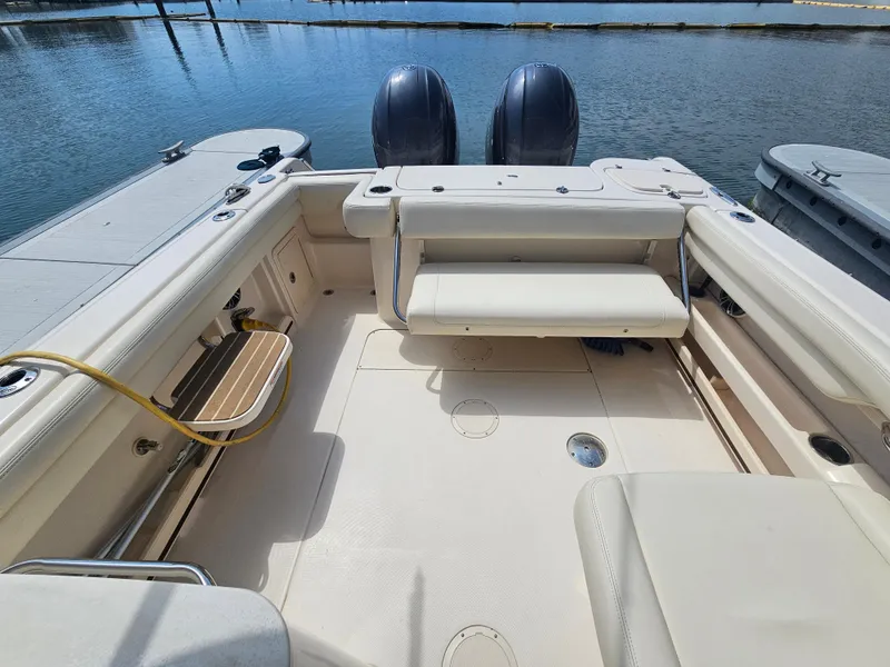 Slide: The Image of Interior of a 2022 Grady-White Freedom 275 boat by the water. - 3