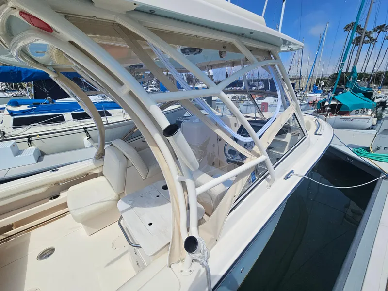 Slide: The Image of 2022 Grady-White Freedom 275 boat docked, side view. - 34